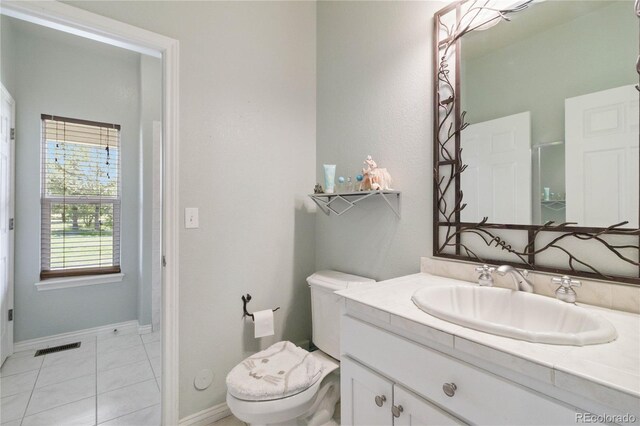 1550 Ajax St, Strasburg, CO 80136 - bathroom featuring vanity, tile patterned floors, and a shower