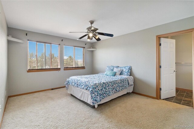 1550 Ajax St, Strasburg, CO 80136 - carpeted bedroom with baseboards and ceiling fan