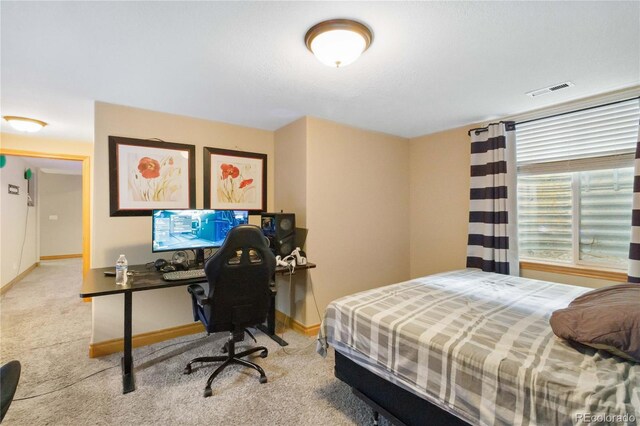 1550 Ajax St, Strasburg, CO 80136 - carpeted bedroom featuring baseboards and an office area