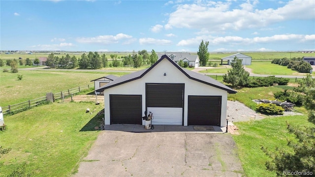 1550 Ajax St, Strasburg, CO 80136 - detached garage featuring a rural view