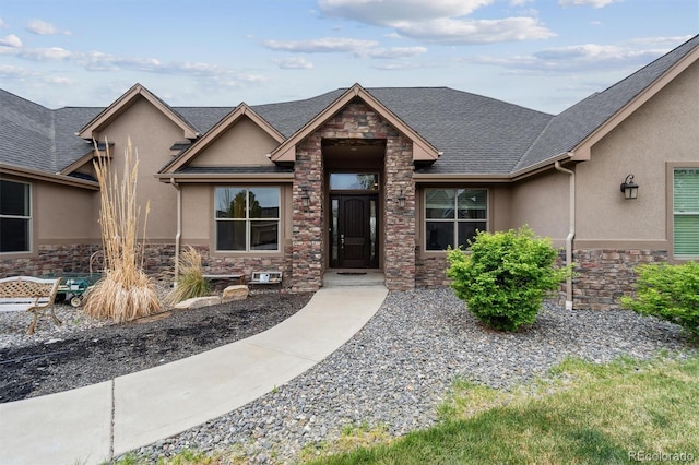 12939 Wabash Ct, Thornton, CO 80602 - view of front facade with stone siding, stucco siding, and a shingled roof
