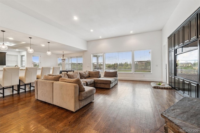 12939 Wabash Ct, Thornton, CO 80602 - living area featuring dark wood-style flooring, recessed lighting, and baseboards