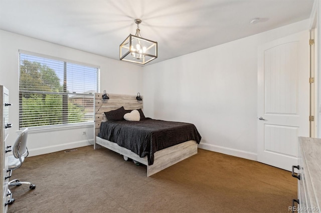12939 Wabash Ct, Thornton, CO 80602 - bedroom featuring baseboards, carpet floors, and a chandelier