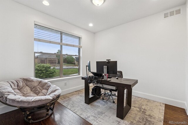 12939 Wabash Ct, Thornton, CO 80602 - home office featuring baseboards, wood finished floors, and recessed lighting