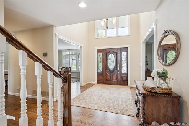 5320 S Geneva St, Englewood, CO 80111 - foyer featuring stairway, wood finished floors, baseboards, and recessed lighting
