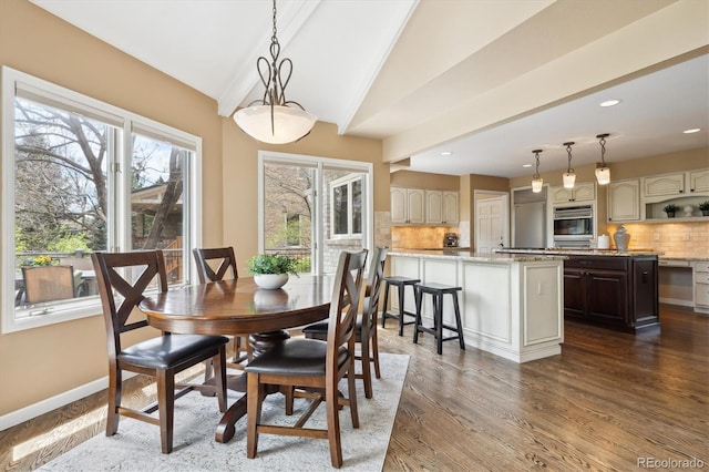 5320 S Geneva St, Englewood, CO 80111 - dining room with dark wood-type flooring, vaulted ceiling, recessed lighting, and baseboards