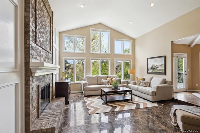 5320 S Geneva St, Englewood, CO 80111 - living room with a brick fireplace, high vaulted ceiling, recessed lighting, and baseboards
