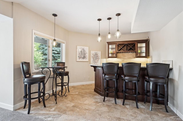 5320 S Geneva St, Englewood, CO 80111 - indoor dry bar featuring decorative light fixtures, baseboards, and decorative backsplash