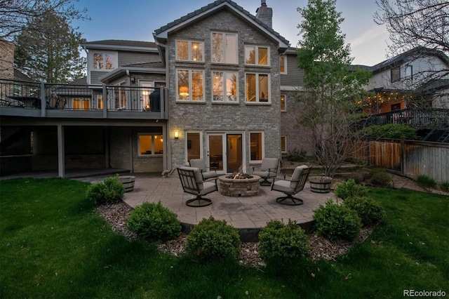 5320 S Geneva St, Englewood, CO 80111 - back of house with an outdoor fire pit, a patio, a chimney, and a wooden deck