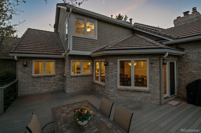 5320 S Geneva St, Englewood, CO 80111 - back of house with a wooden deck and a chimney