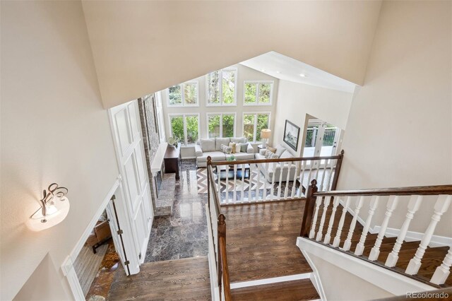 5320 S Geneva St, Englewood, CO 80111 - stairs featuring a high ceiling and wood finished floors