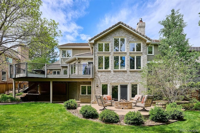 5320 S Geneva St, Englewood, CO 80111 - back of house with an outdoor fire pit, a wooden deck, a lawn, and a patio area