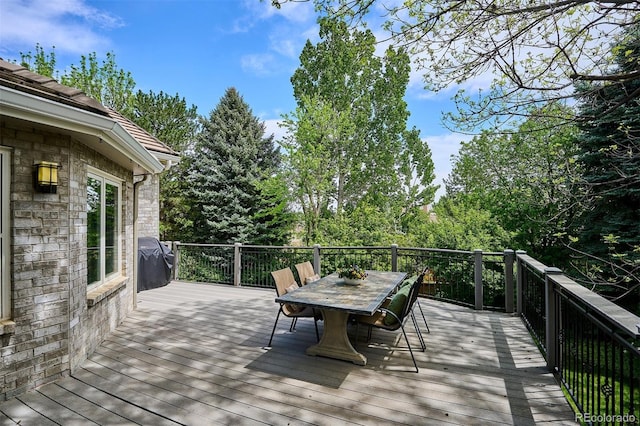 5320 S Geneva St, Englewood, CO 80111 - deck featuring outdoor dining area, area for grilling, and view of scattered trees