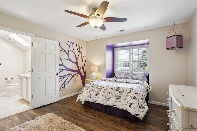 5320 S Geneva St, Englewood, CO 80111 - bedroom featuring dark wood-style flooring, ensuite bathroom, baseboards, and a ceiling fan