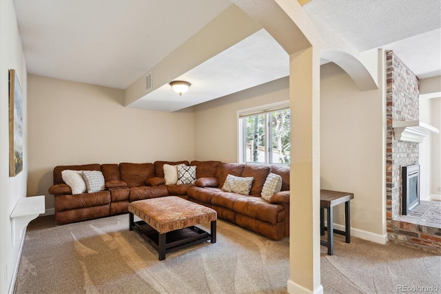 5320 S Geneva St, Englewood, CO 80111 - living area featuring carpet, a brick fireplace, baseboards, and arched walkways