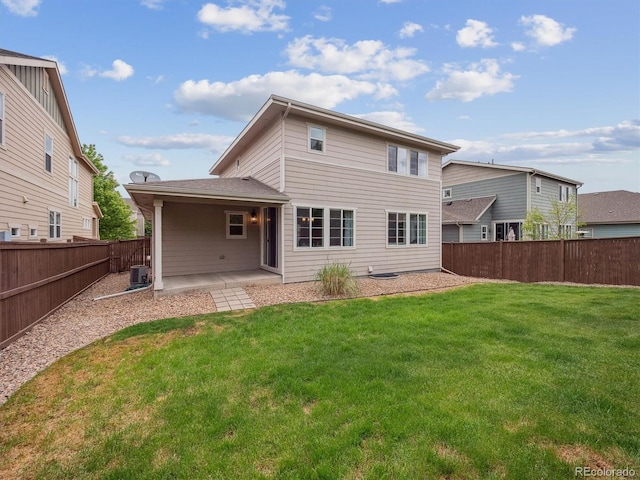 15350 W 50th Dr, Golden, CO 80403 - back of property featuring central air condition unit and a patio