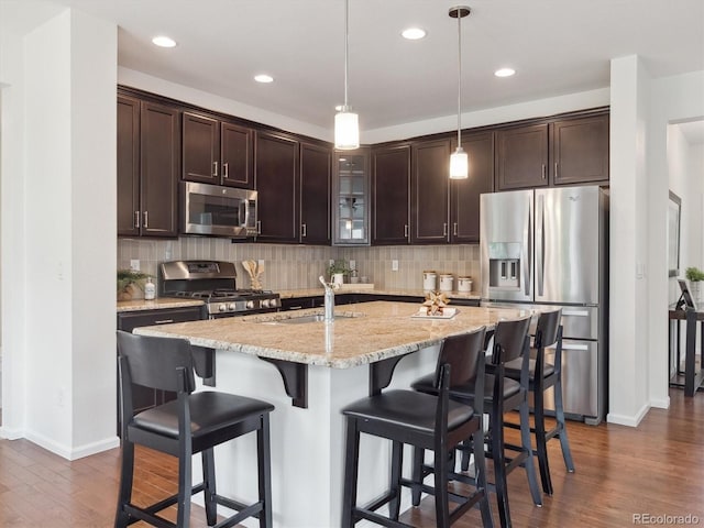 15350 W 50th Dr, Golden, CO 80403 - kitchen featuring stainless steel appliances, a sink, dark brown cabinetry, dark wood-type flooring, and recessed lighting