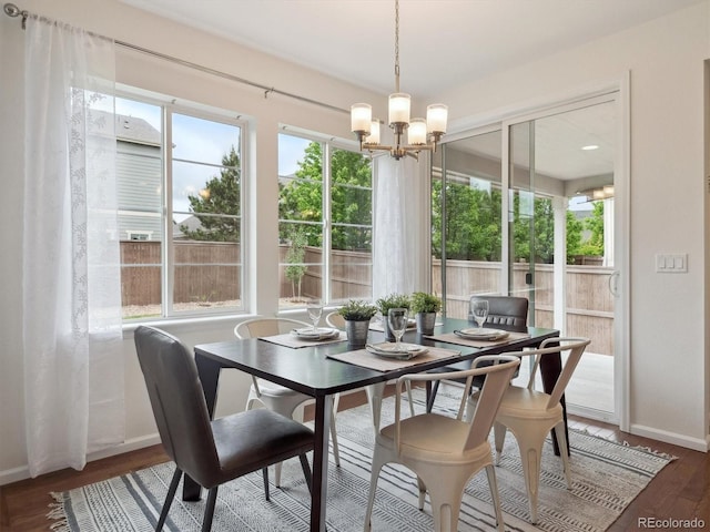 15350 W 50th Dr, Golden, CO 80403 - dining room with a chandelier, baseboards, and wood finished floors