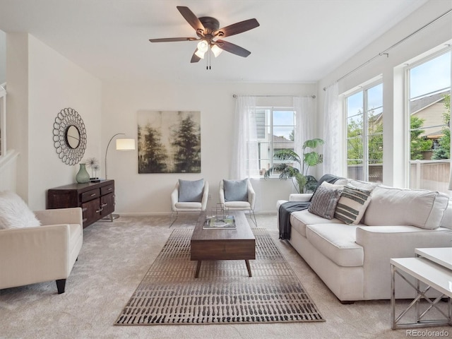 15350 W 50th Dr, Golden, CO 80403 - living area featuring plenty of natural light, light colored carpet, and a ceiling fan