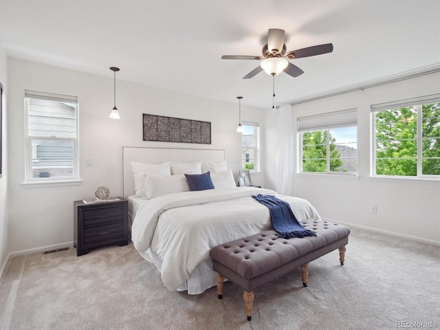 15350 W 50th Dr, Golden, CO 80403 - bedroom featuring light carpet, baseboards, and a ceiling fan