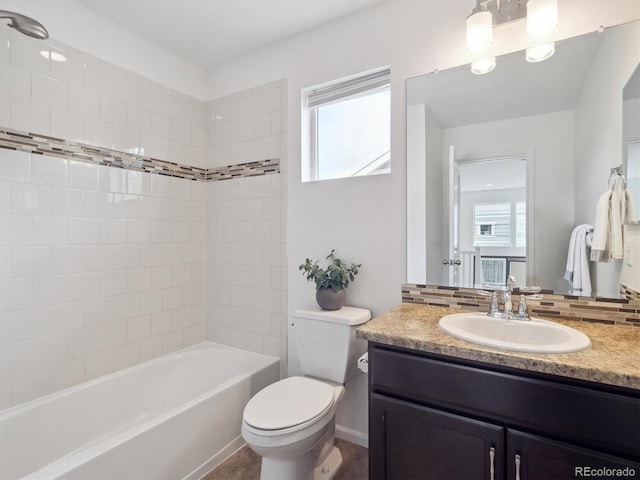 15350 W 50th Dr, Golden, CO 80403 - full bathroom with vanity, toilet, plenty of natural light, and tub / shower combination