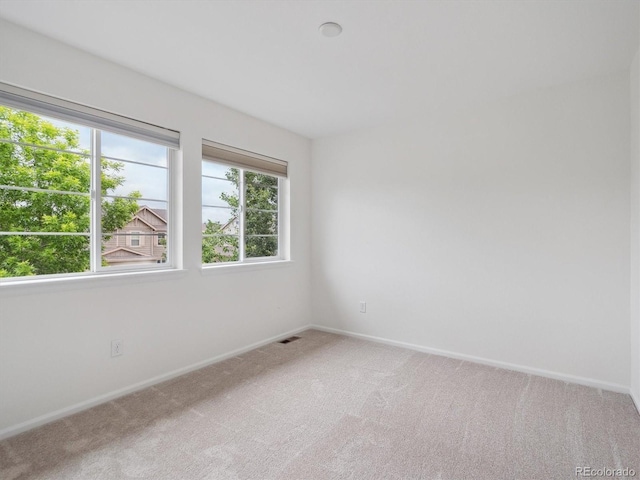 15350 W 50th Dr, Golden, CO 80403 - spare room featuring light colored carpet and baseboards
