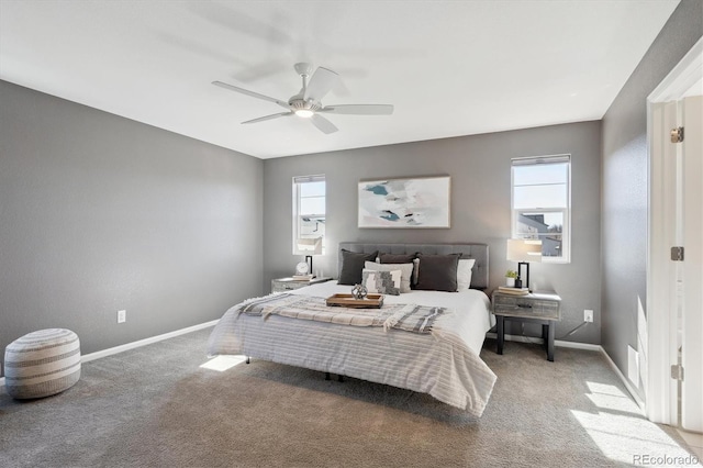 carpeted bedroom featuring ceiling fan and baseboards