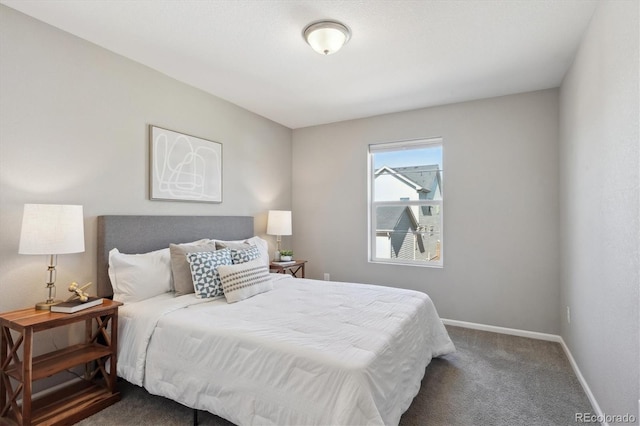 carpeted bedroom featuring baseboards