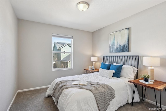 bedroom with carpet floors and baseboards