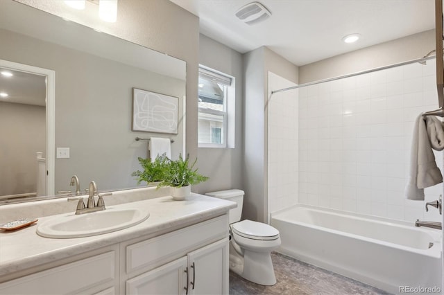 bathroom featuring visible vents, toilet, vanity, washtub / shower combination, and recessed lighting