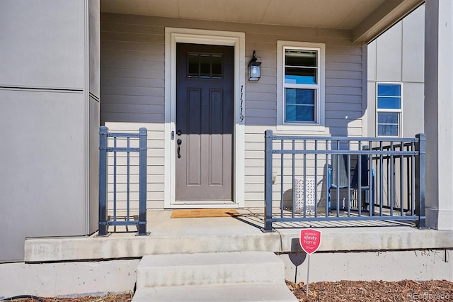 doorway to property with covered porch