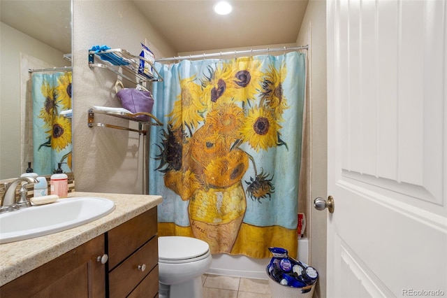 full bathroom featuring tile patterned flooring, vanity, toilet, and shower / tub combo