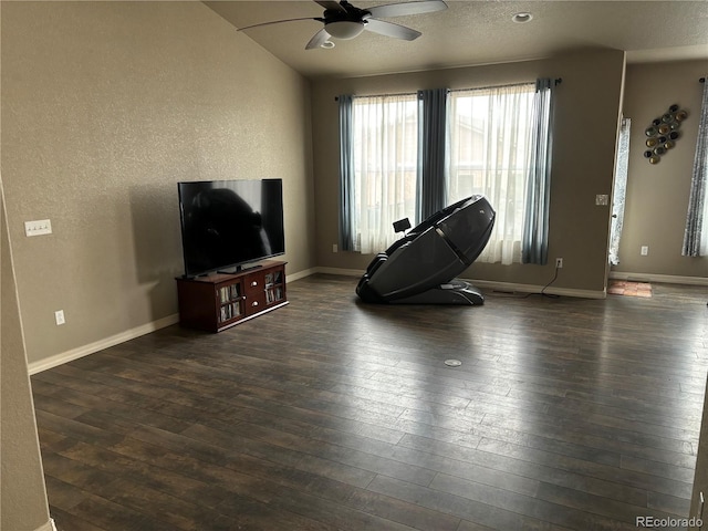 interior space with ceiling fan and dark wood-type flooring