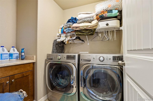 clothes washing area featuring washing machine and clothes dryer