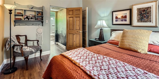 bedroom featuring wood finished floors and baseboards
