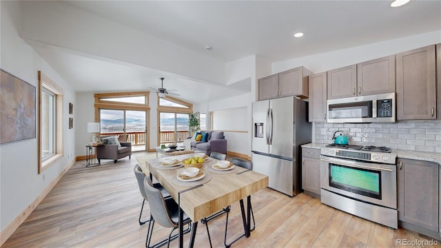 374 County Road 863, Tabernash, CO 80478 - kitchen featuring appliances with stainless steel finishes, open floor plan, light wood-style flooring, ceiling fan, and tasteful backsplash