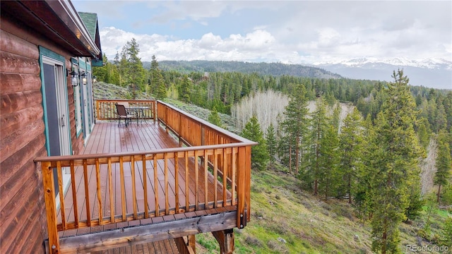 374 County Road 863, Tabernash, CO 80478 - wooden terrace featuring a view of trees and outdoor dining area