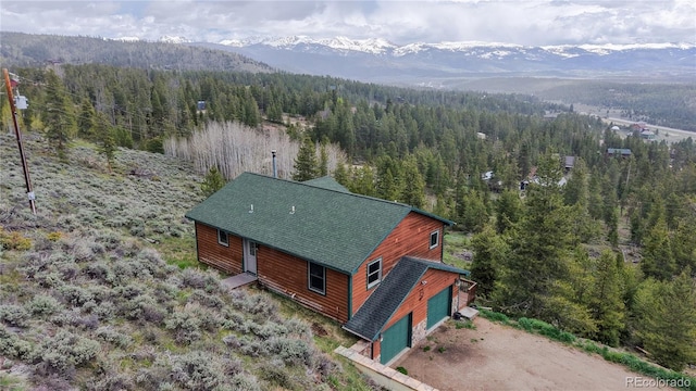 374 County Road 863, Tabernash, CO 80478 - view of subject property featuring a heavily wooded area and a mountainous background