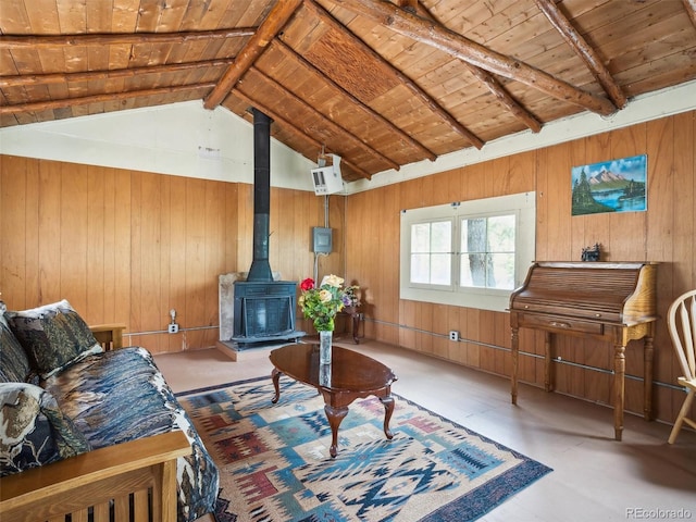 living area featuring a wood stove, wood ceiling, wood walls, and vaulted ceiling with beams