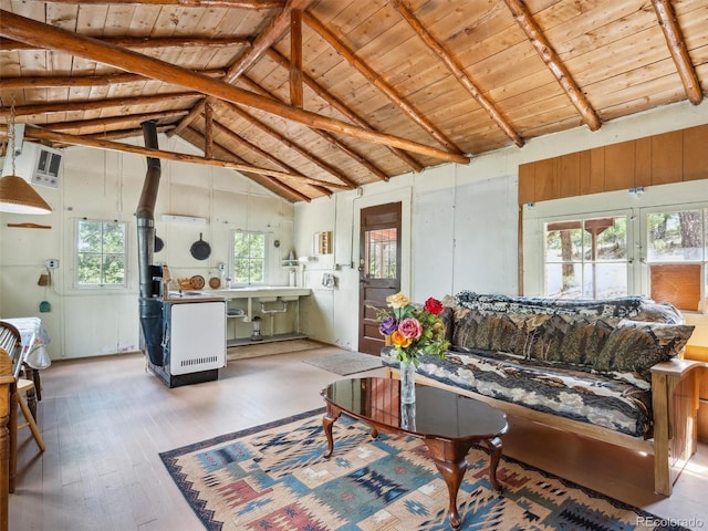 living room featuring beamed ceiling, high vaulted ceiling, wooden ceiling, and hardwood / wood-style flooring