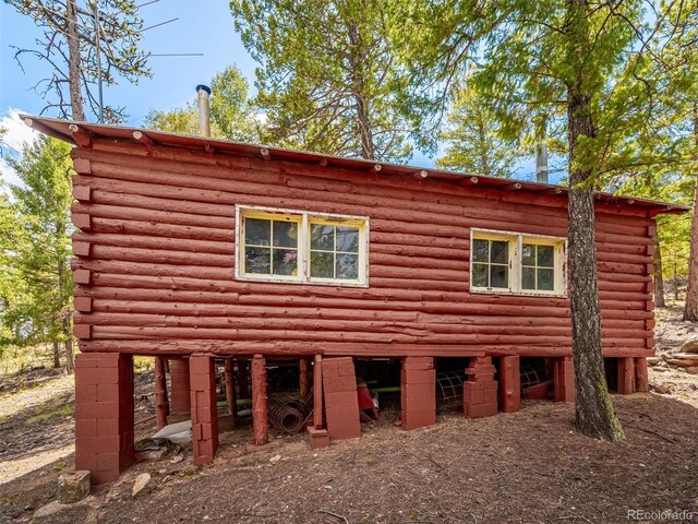 view of side of property featuring log siding