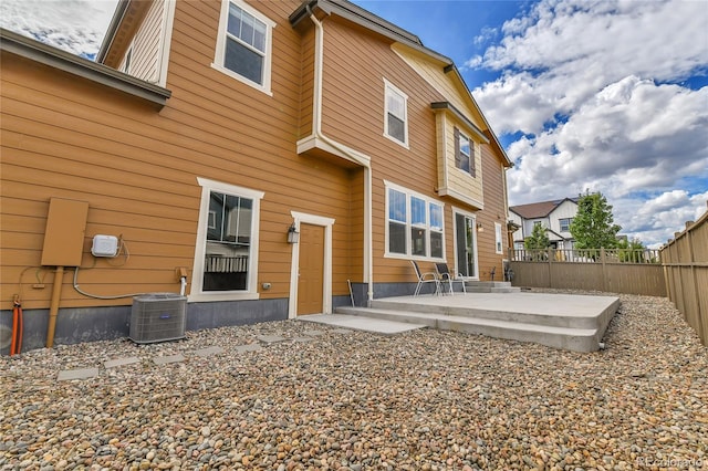 back of property featuring a patio area and central air condition unit