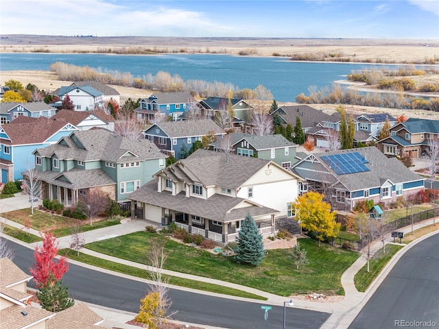 bird's eye view featuring a water view and a residential view