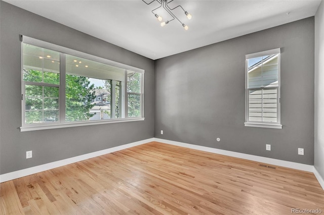750 Deer Clover Cir, Castle Pines, CO 80108 - unfurnished room with plenty of natural light and wood finished floors