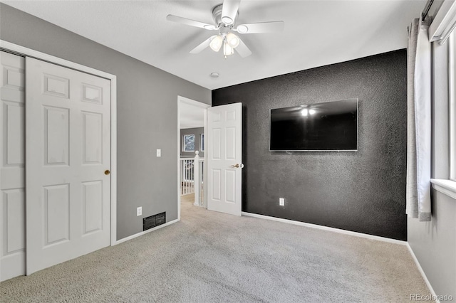 750 Deer Clover Cir, Castle Pines, CO 80108 - unfurnished bedroom featuring carpet flooring and ceiling fan