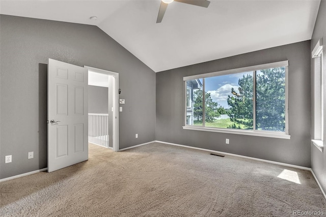 750 Deer Clover Cir, Castle Pines, CO 80108 - spare room with plenty of natural light, ceiling fan, vaulted ceiling, and carpet floors