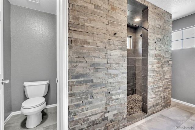 750 Deer Clover Cir, Castle Pines, CO 80108 - full bath with a walk in shower, a textured ceiling, and tile patterned flooring