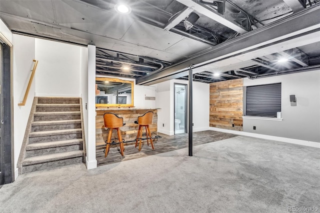 750 Deer Clover Cir, Castle Pines, CO 80108 - finished below grade area with a bar, stairway, carpet flooring, and wood walls