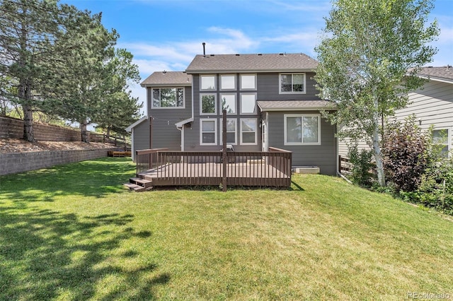750 Deer Clover Cir, Castle Pines, CO 80108 - back of property featuring a deck, a yard, and roof with shingles