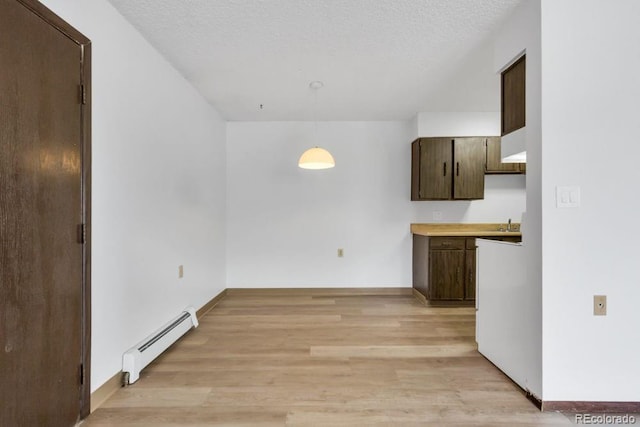 512 E Monroe Dr Unit D438, Fort Collins, CO 80525 - unfurnished dining area with baseboard heating and light wood-style floors